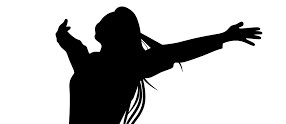 Silhouette of a woman with her arms outstretched