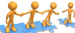 Stick humanoid figures holding hands, standing on interlocking jigsaw pieces