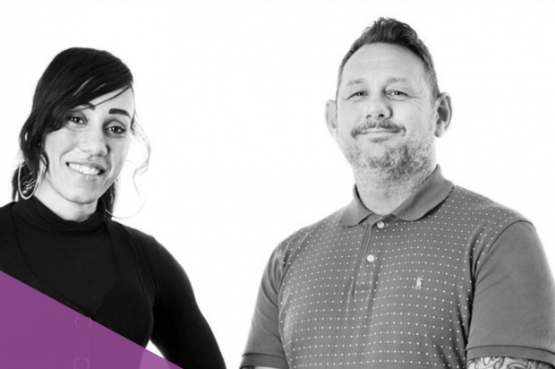 Photograph of two smiling Change Grow Live colleagues