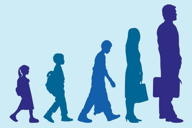 Silhouettes of boy and girl growing into adults 