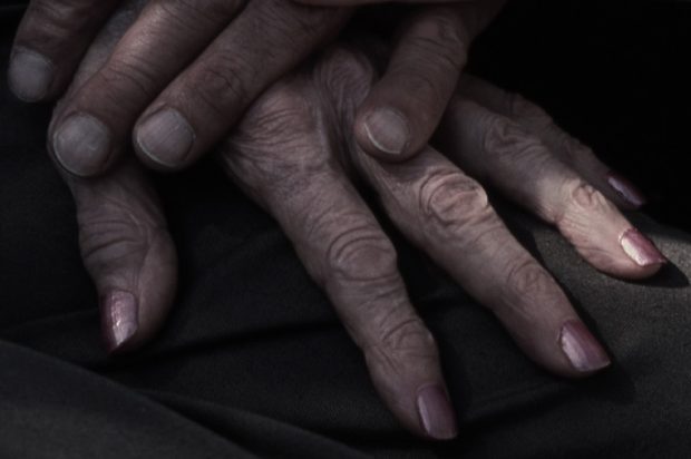 Wrinkled hands of an older person